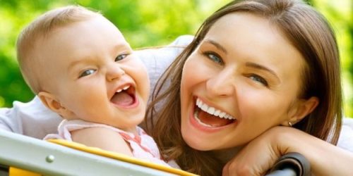An aupair and a baby outdoors An aupair and a baby outdoors